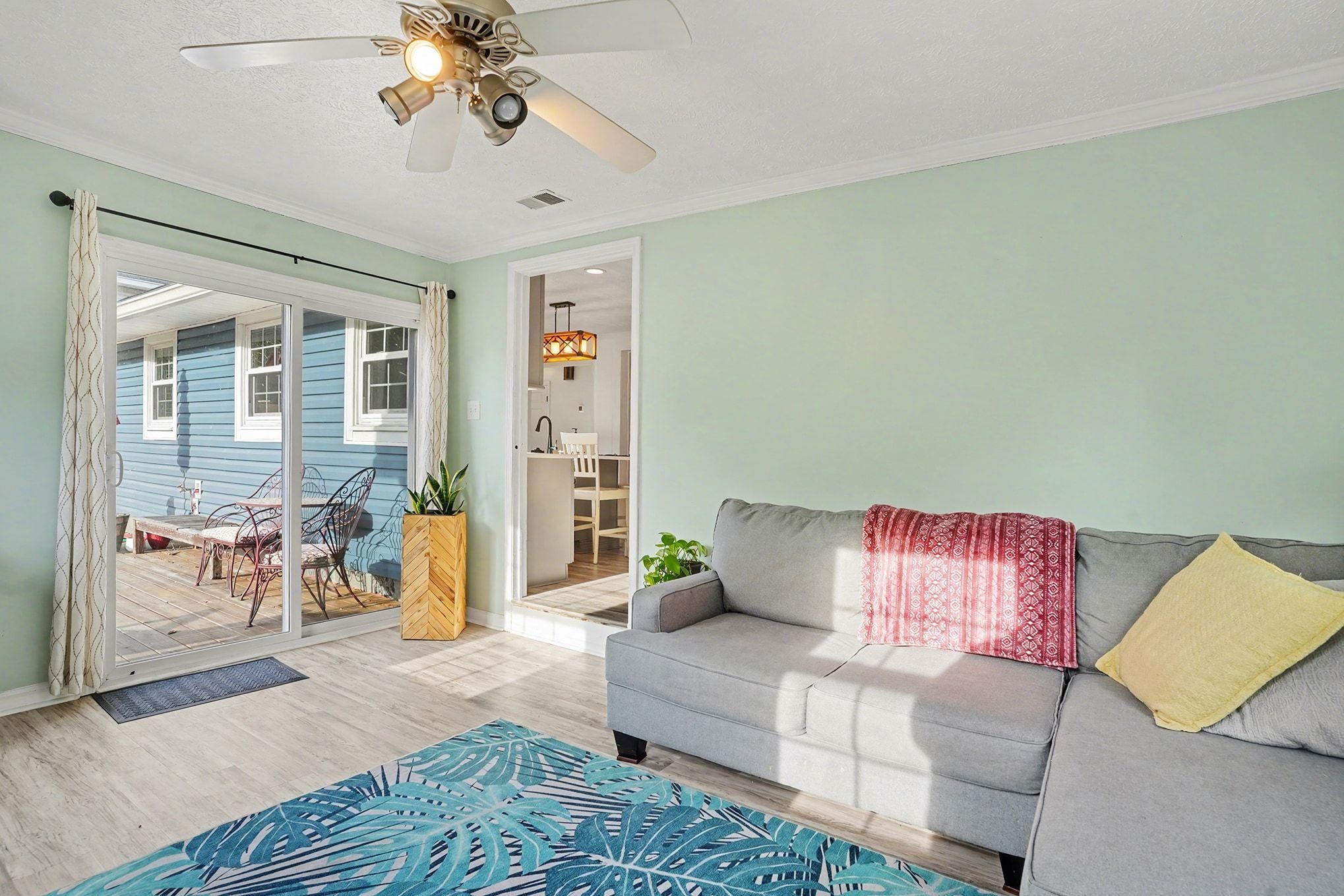 317 Jay Street Murrells Inlet, SC 29576 - Photo 29 of 36 Living area featuring wood finished floors, crown molding, and ceiling fan