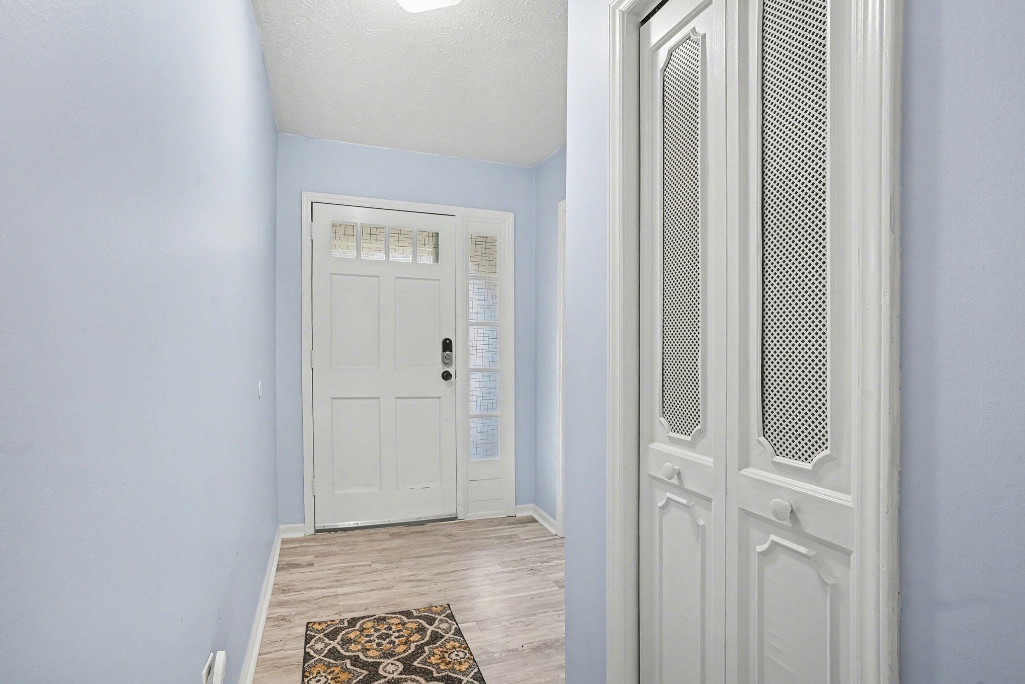 317 Jay Street Murrells Inlet, SC 29576 - Photo 4 of 36 Entrance foyer featuring light wood-type flooring and a textured ceiling