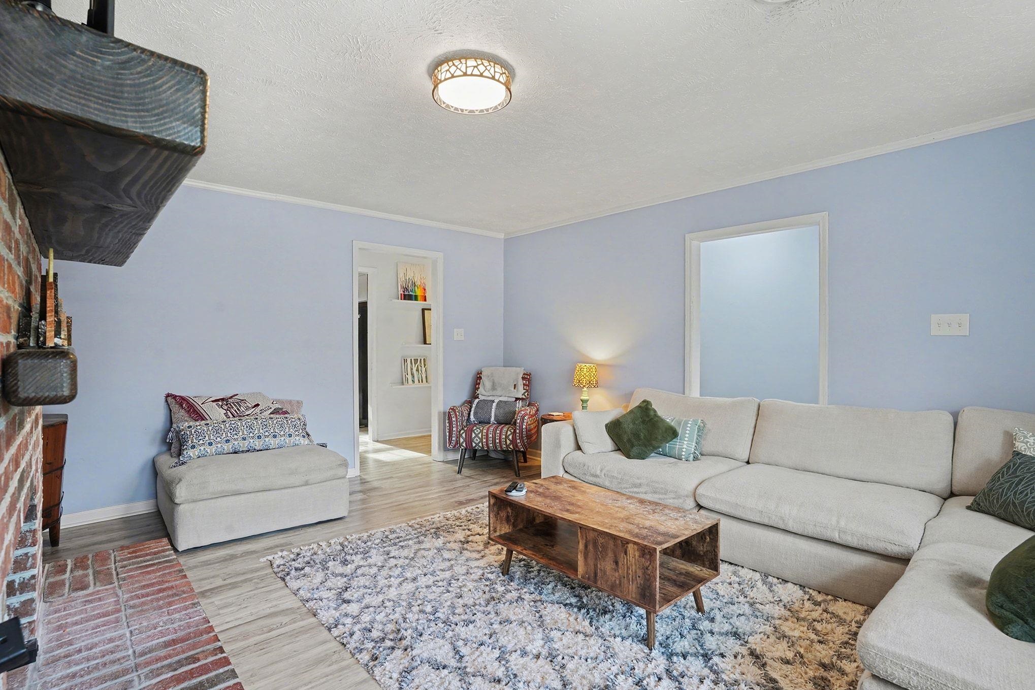 317 Jay Street Murrells Inlet, SC 29576 - Photo 8 of 36 Living area with a textured ceiling, crown molding, and wood finished floors