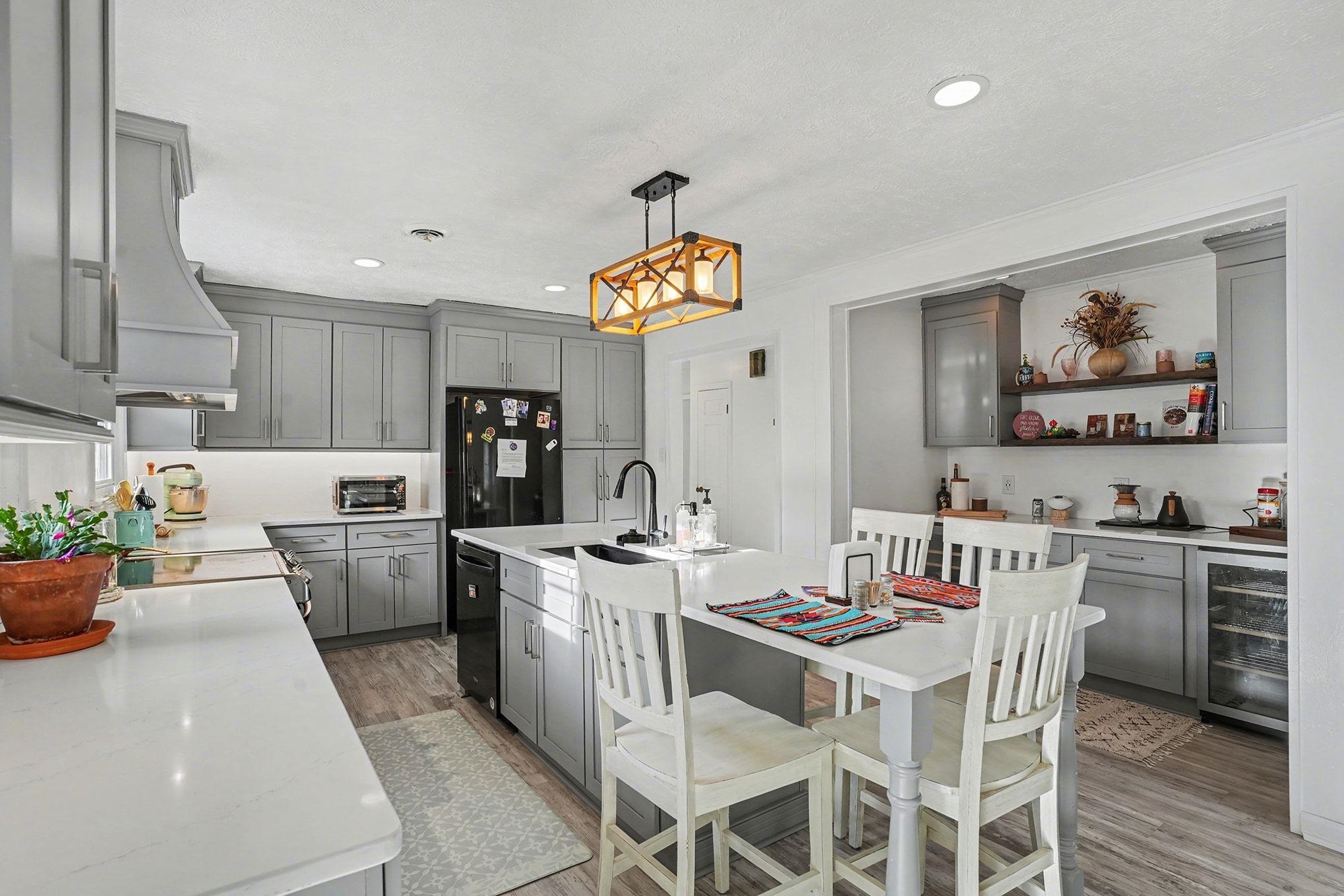 317 Jay Street Murrells Inlet, SC 29576 - Photo 9 of 36 Kitchen featuring gray cabinetry, an island with sink, light wood-style flooring, decorative light fixtures, and recessed lighting