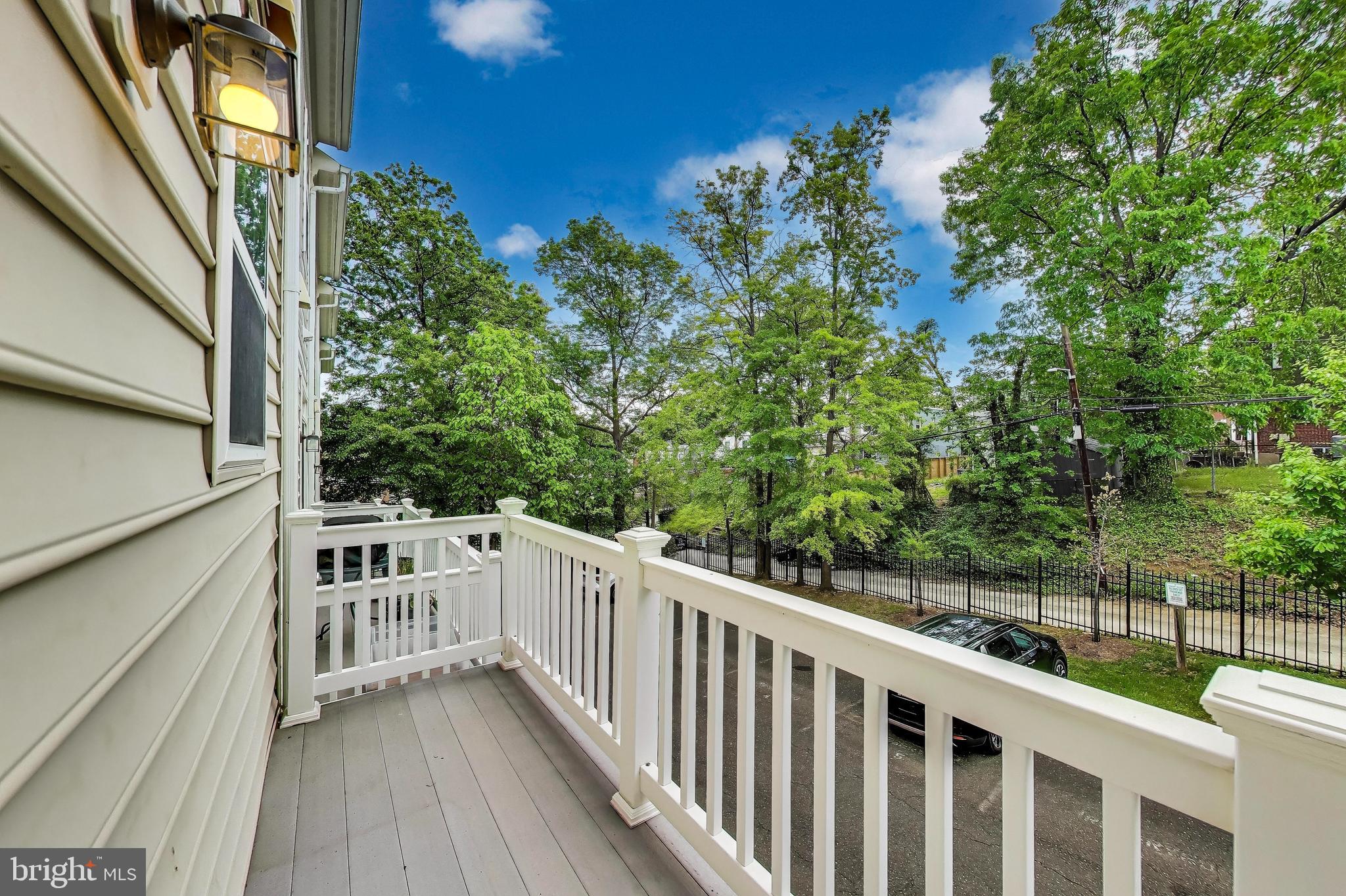 138 Danbury Street Southwest Washington, DC 20032 - Photo 14 of 32 a view of a balcony with wooden floor and fence