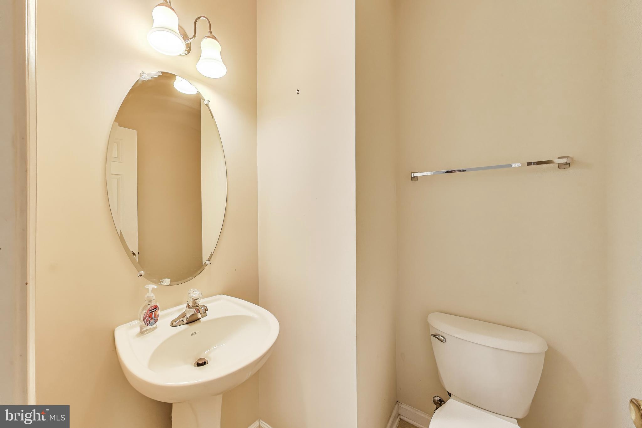 138 Danbury Street Southwest Washington, DC 20032 - Photo 17 of 32 a bathroom with a sink and a mirror