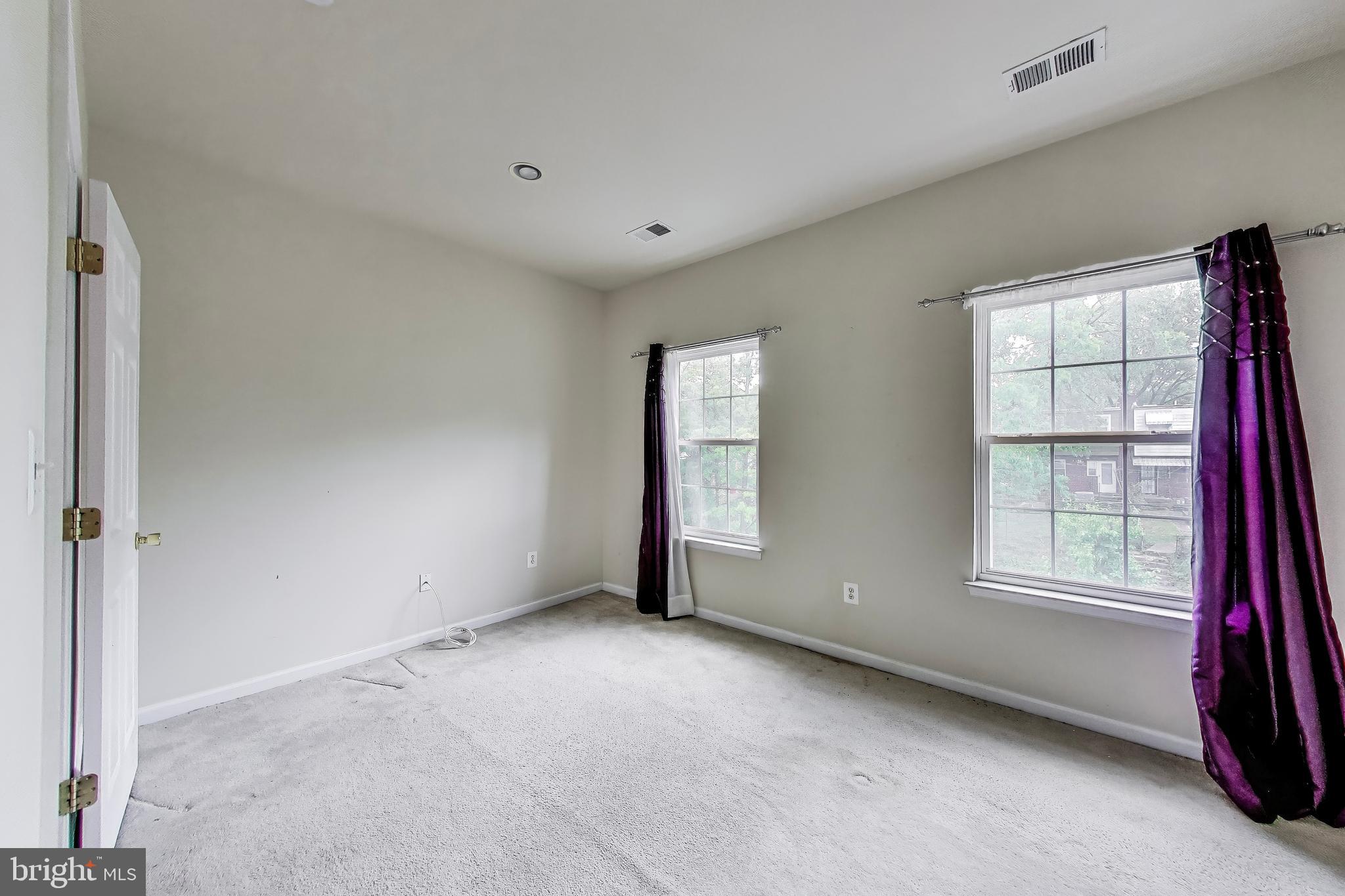138 Danbury Street Southwest Washington, DC 20032 - Photo 20 of 32 an empty room with windows
