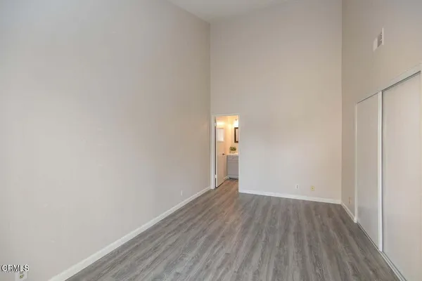 a bathroom with a toilet a sink a vanity and mirror