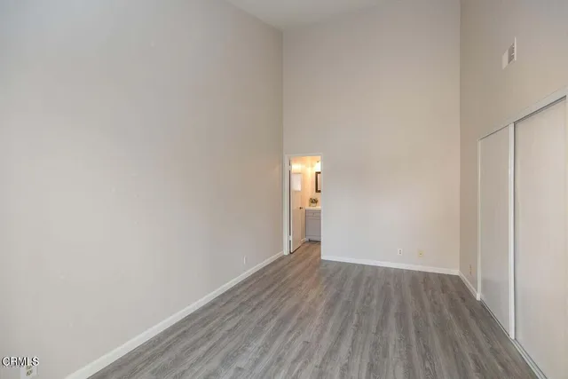 a bathroom with a toilet a sink a vanity and mirror