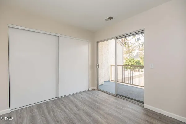 a view of a balcony with yard