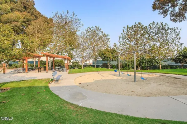 a view of a park with large trees