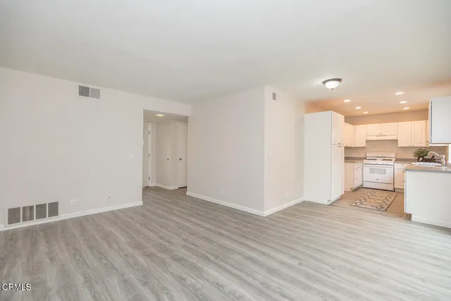a view of kitchen with wooden floor