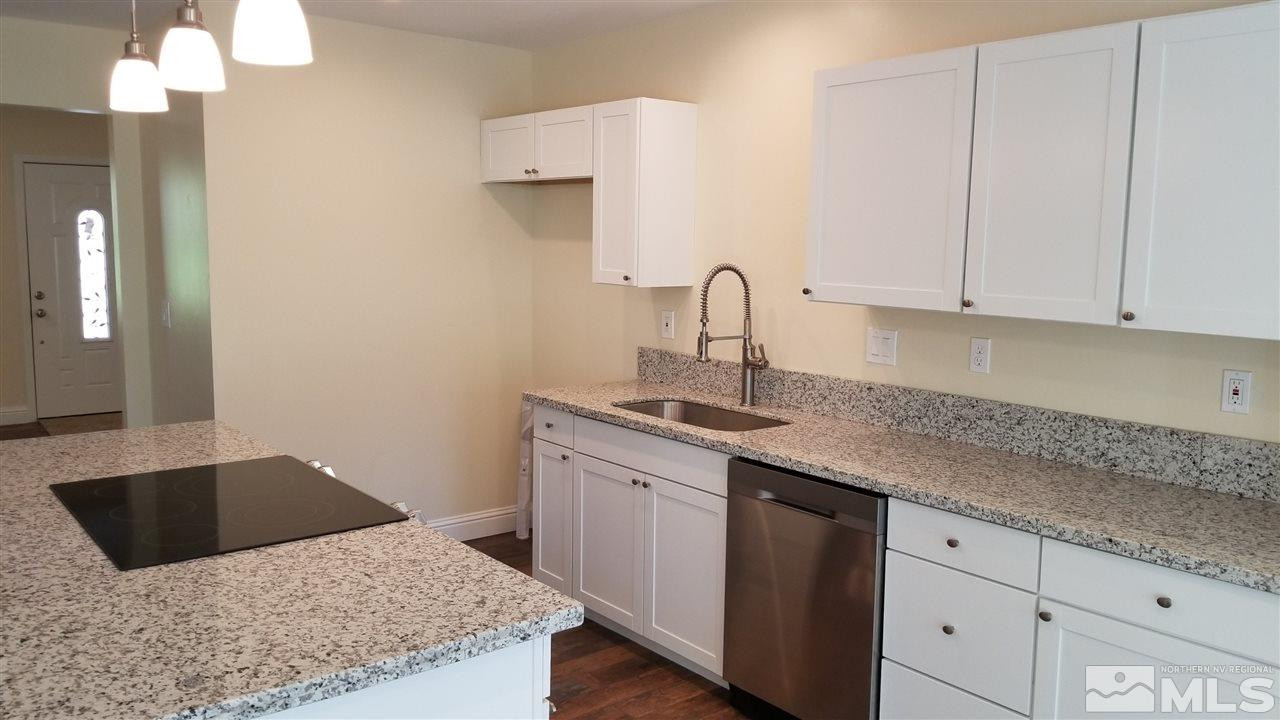 812 Gear Street Reno, NV 89503 - Photo 3 of 21 a kitchen with a sink and cabinets