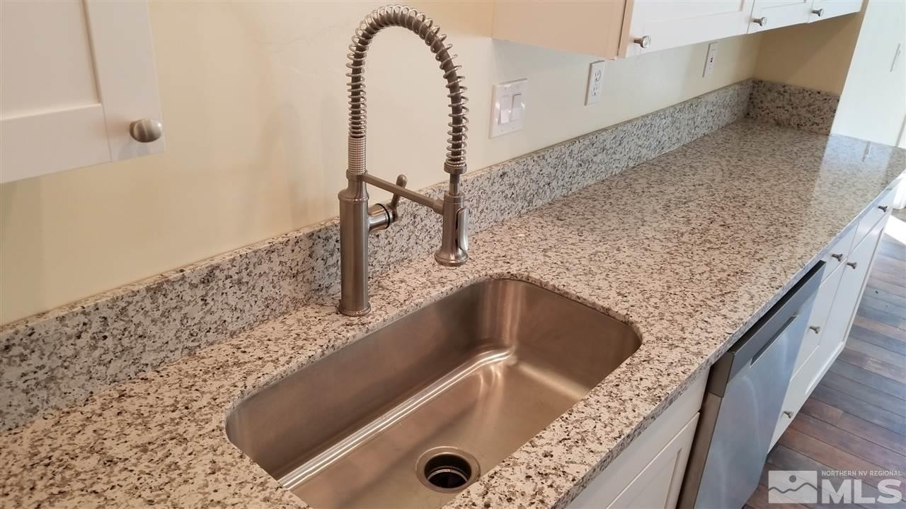 812 Gear Street Reno, NV 89503 - Photo 5 of 21 a bathroom with a granite countertop sink and shower