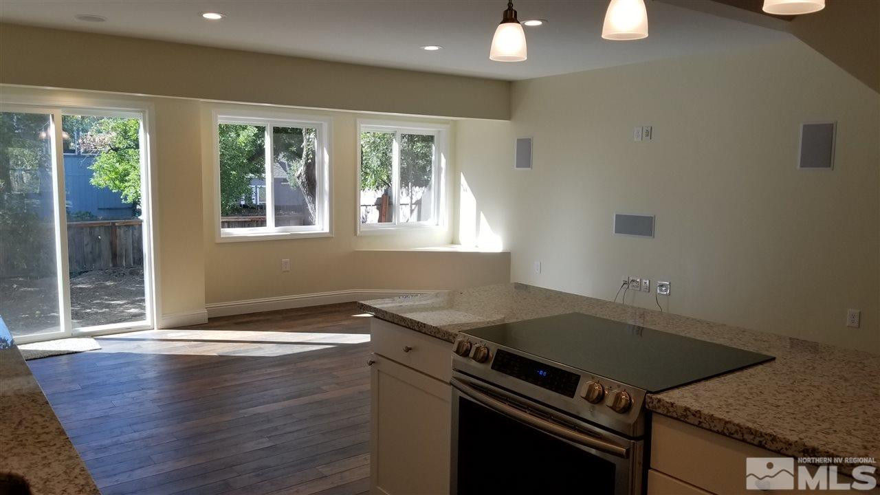 812 Gear Street Reno, NV 89503 - Photo 7 of 21 a kitchen that has a sink stainless steel appliances wooden floor and a window