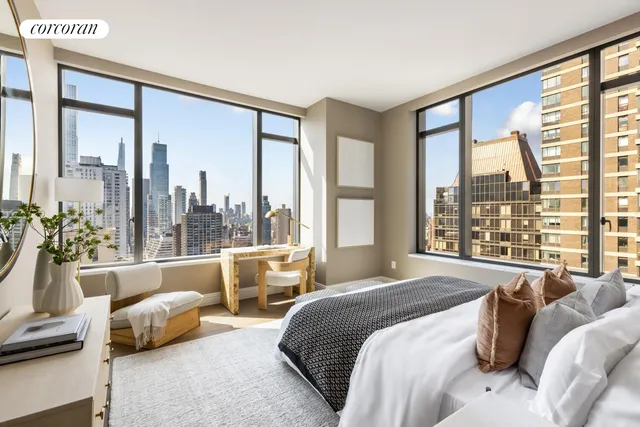 a dining room with furniture and a chandelier