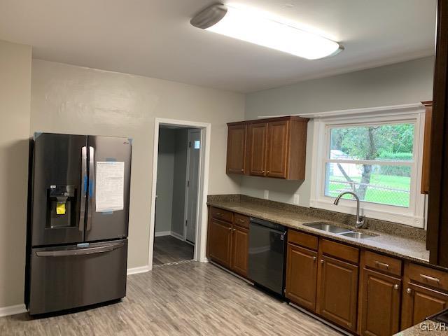 112 A Street Bangor, PA 18013 - Photo 4 of 6 a kitchen with stainless steel appliances granite countertop a refrigerator and a sink