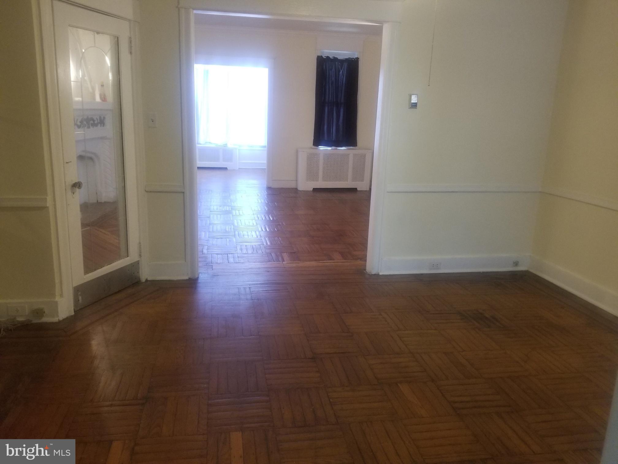 226 Copley Road Upper Darby, PA 19082 - Photo 3 of 10 a view of a hallway with wooden floor
