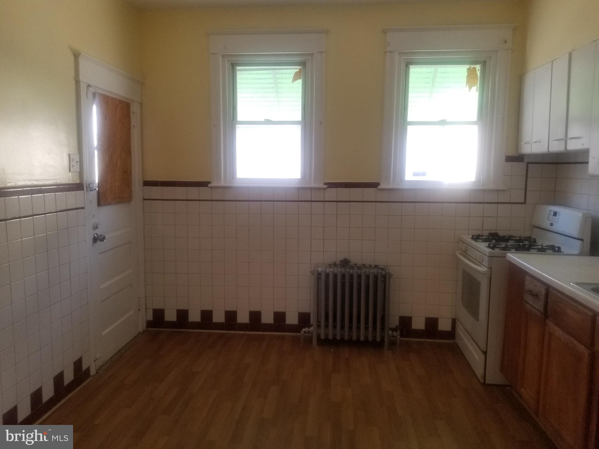 226 Copley Road Upper Darby, PA 19082 - Photo 5 of 10 a room with a window and a wooden floor