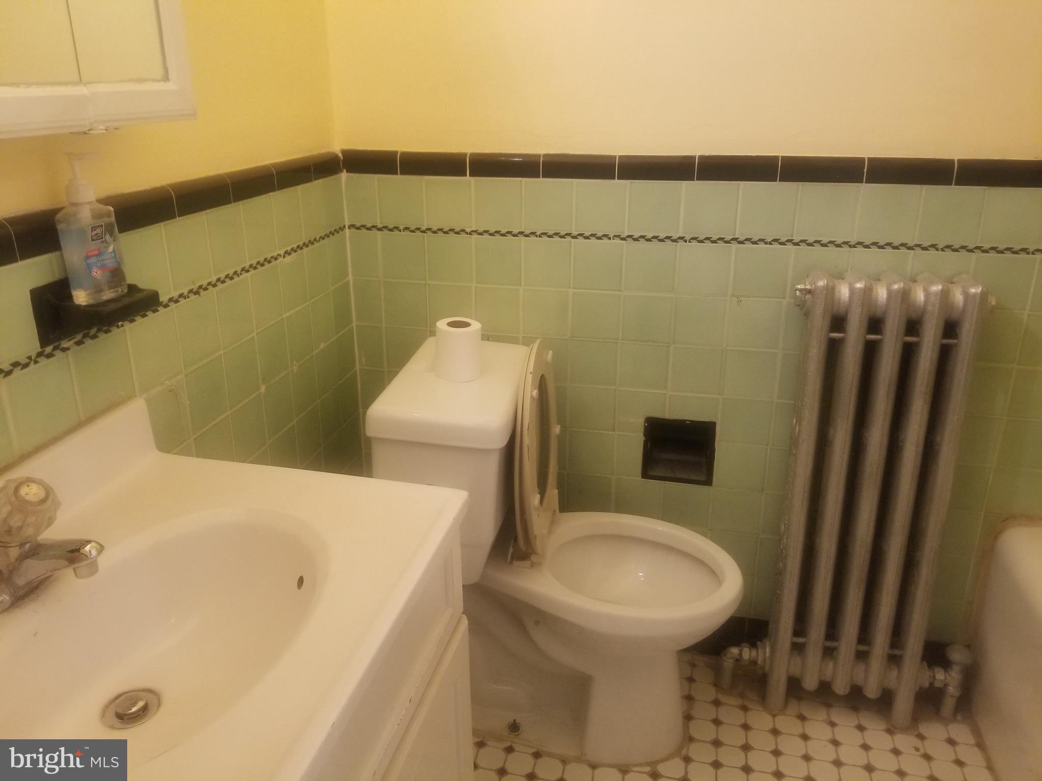226 Copley Road Upper Darby, PA 19082 - Photo 7 of 10 a bathroom with a sink and a toilet