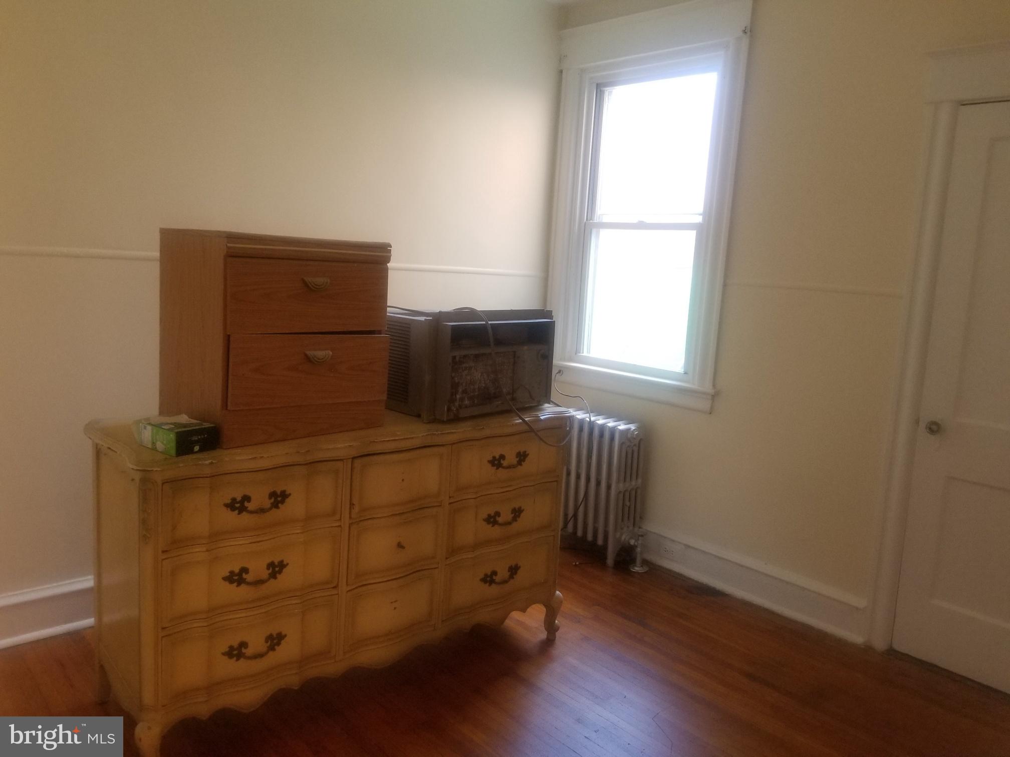 226 Copley Road Upper Darby, PA 19082 - Photo 8 of 10 a room with furniture and wooden floor