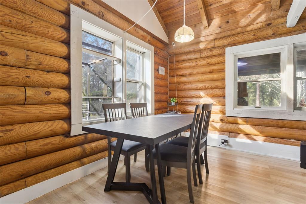 1208 D Arcy Road Lady Lake, FL 32159 - Photo 16 of 50 a dining room with furniture and wooden floor