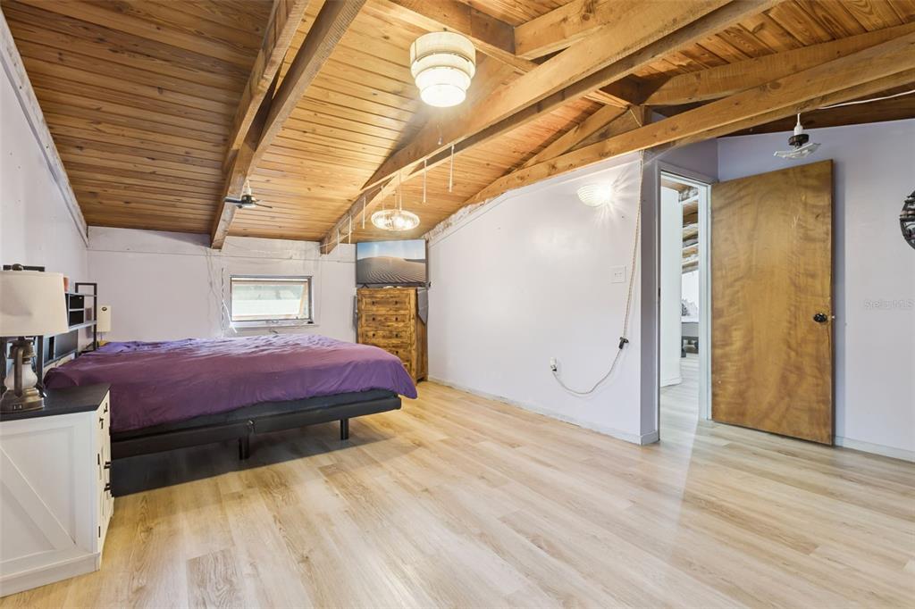 1208 D Arcy Road Lady Lake, FL 32159 - Photo 17 of 50 a spacious bedroom with a bed and a table