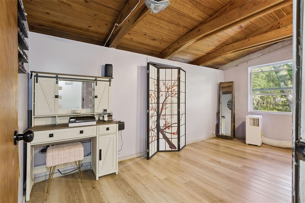1208 D Arcy Road Lady Lake, FL 32159 - Photo 20 of 50 a view of an empty room with window and wooden floor