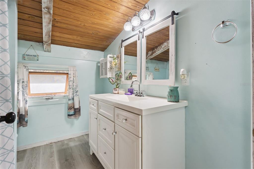 1208 D Arcy Road Lady Lake, FL 32159 - Photo 21 of 50 a utility room with cabinets washer and dryer