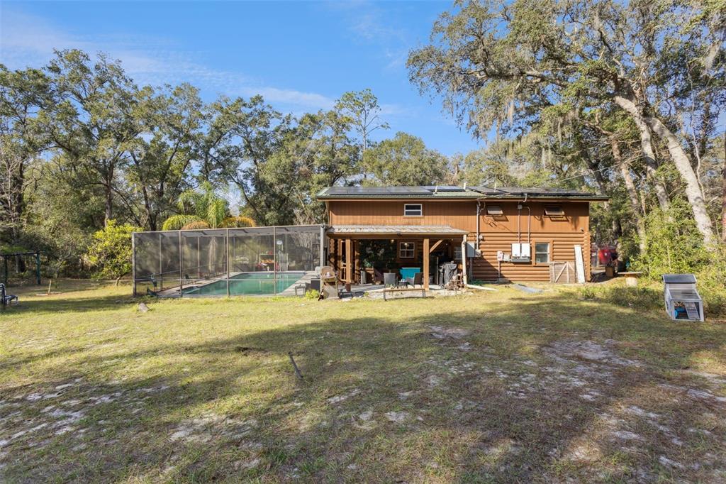 1208 D Arcy Road Lady Lake, FL 32159 - Photo 36 of 50 a view of a house with a yard and tree s