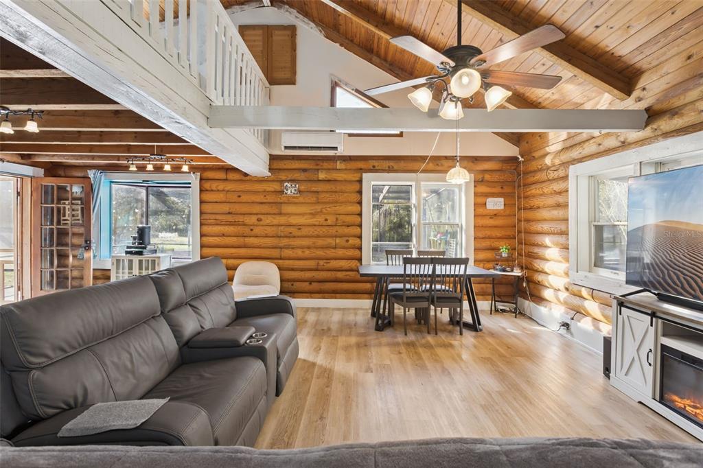 1208 D Arcy Road Lady Lake, FL 32159 - Photo 7 of 50 a living room with furniture and wooden floor