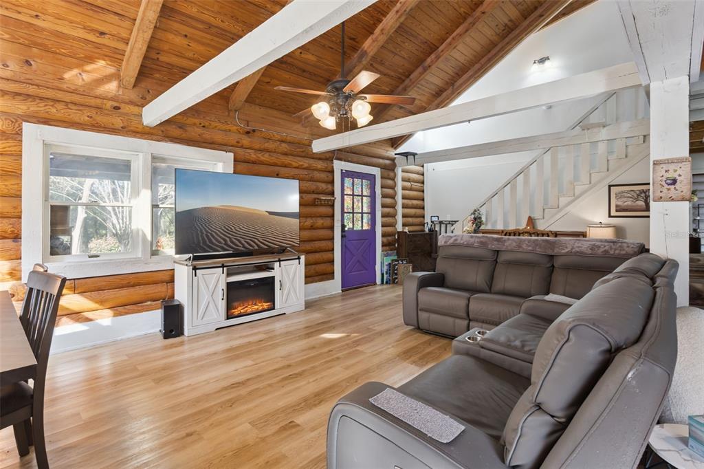 1208 D Arcy Road Lady Lake, FL 32159 - Photo 10 of 50 a living room with furniture and a flat screen tv