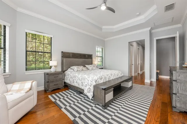 a bedroom with a bed and a couch