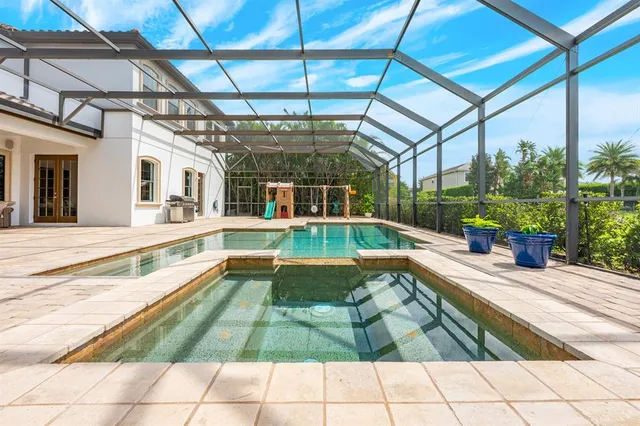 a view of swimming pool with seating area