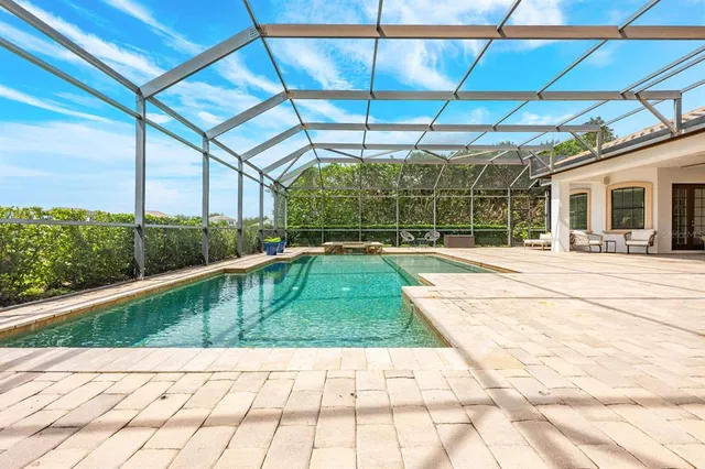 a view of a swimming pool with a patio