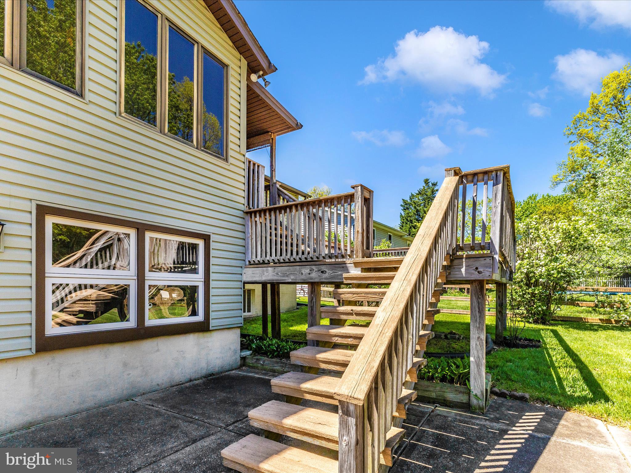 8344 Capel Drive Pasadena, MD 21122 - Photo 11 of 30 a view of a house with a yard and balcony