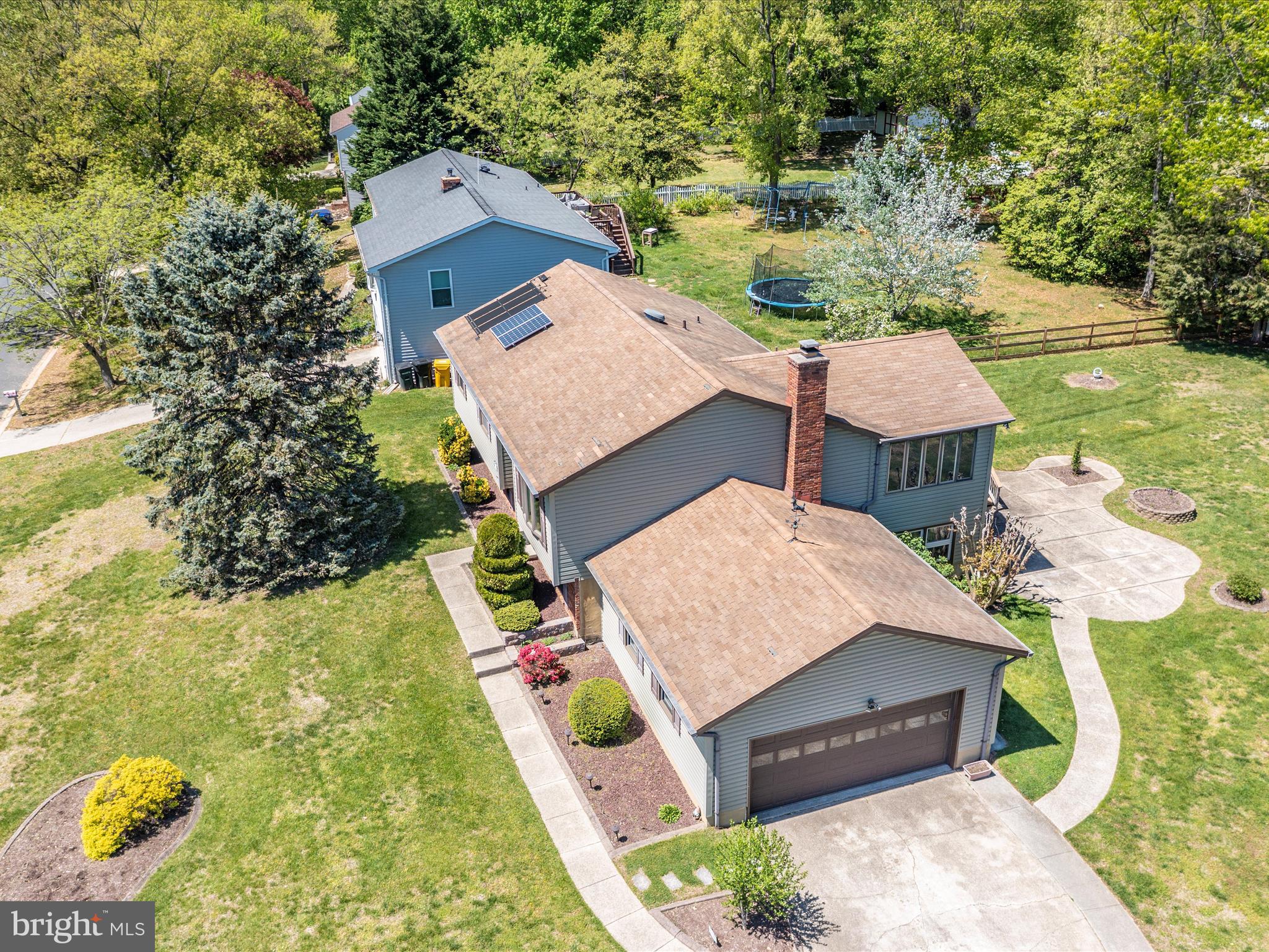 8344 Capel Drive Pasadena, MD 21122 - Photo 13 of 30 an aerial view of a house with swimming pool and large trees