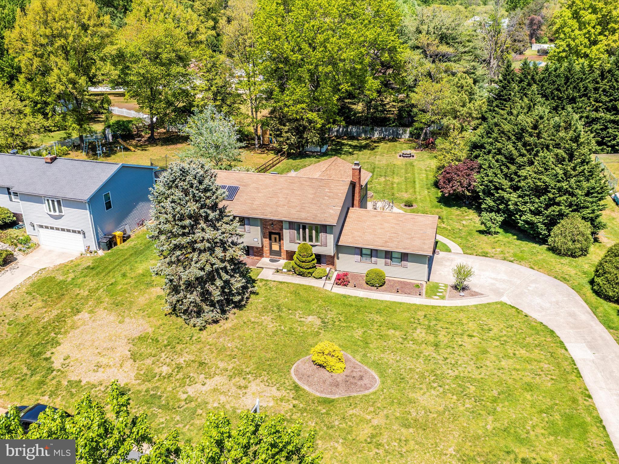 8344 Capel Drive Pasadena, MD 21122 - Photo 14 of 30 a view of a swimming pool with an outdoor space and seating area