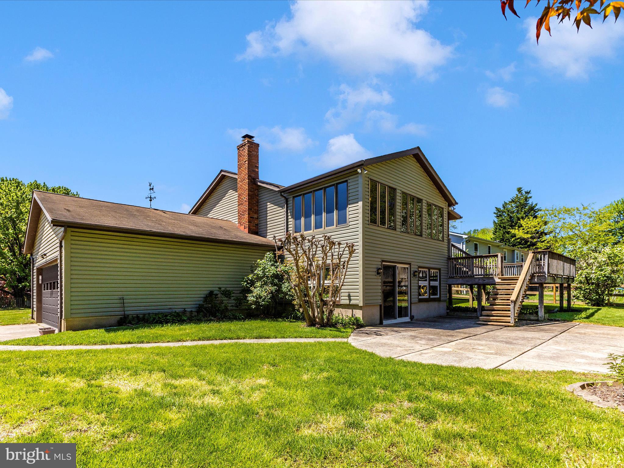 8344 Capel Drive Pasadena, MD 21122 - Photo 2 of 30 a front view of a house with garden