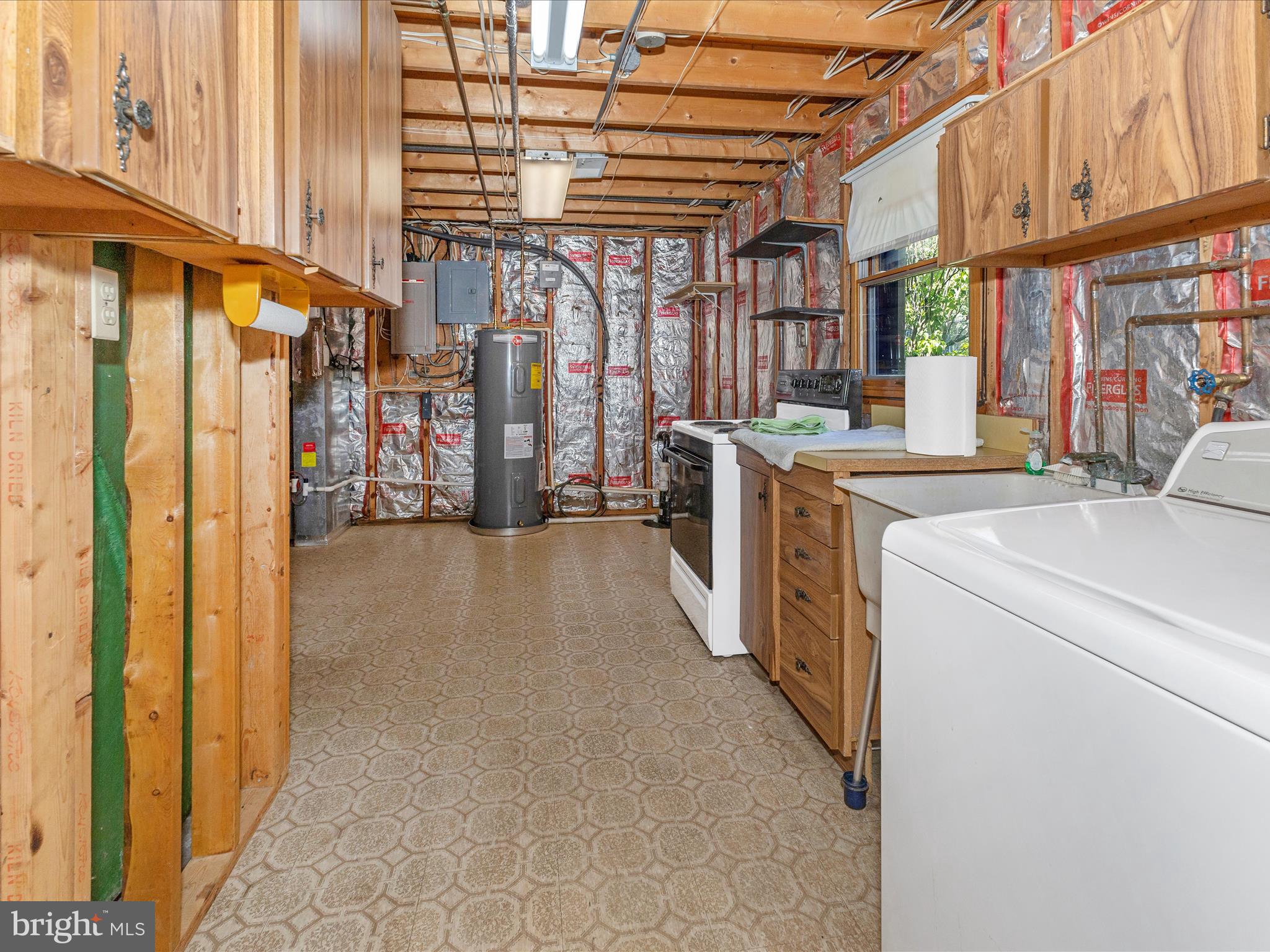 8344 Capel Drive Pasadena, MD 21122 - Photo 23 of 30 a view of a storage & utility room with washer and dryer