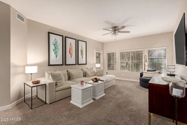 a living room with furniture and a large window