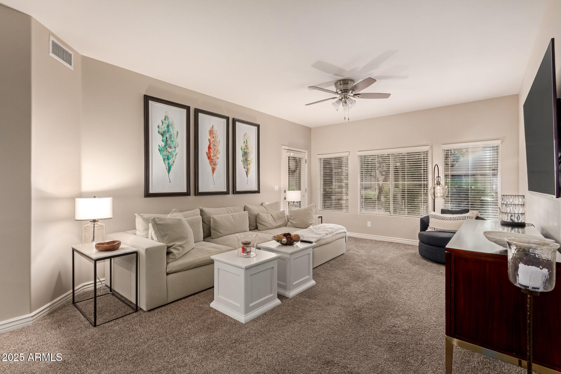 5350 East Deer Valley Drive, Unit 1259 Phoenix, AZ 85054 - Photo 3 of 35 a living room with furniture and a large window