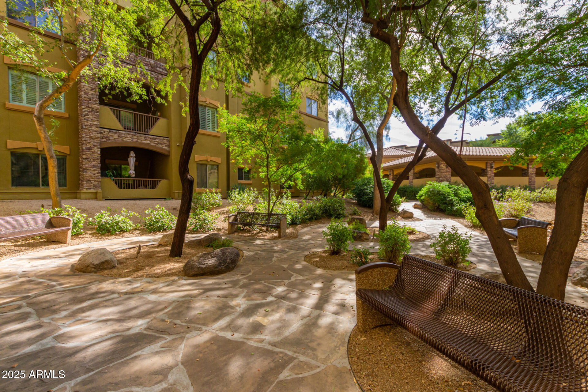 5350 East Deer Valley Drive, Unit 1259 Phoenix, AZ 85054 - Photo 32 of 35 a view of a house with backyard and a tree