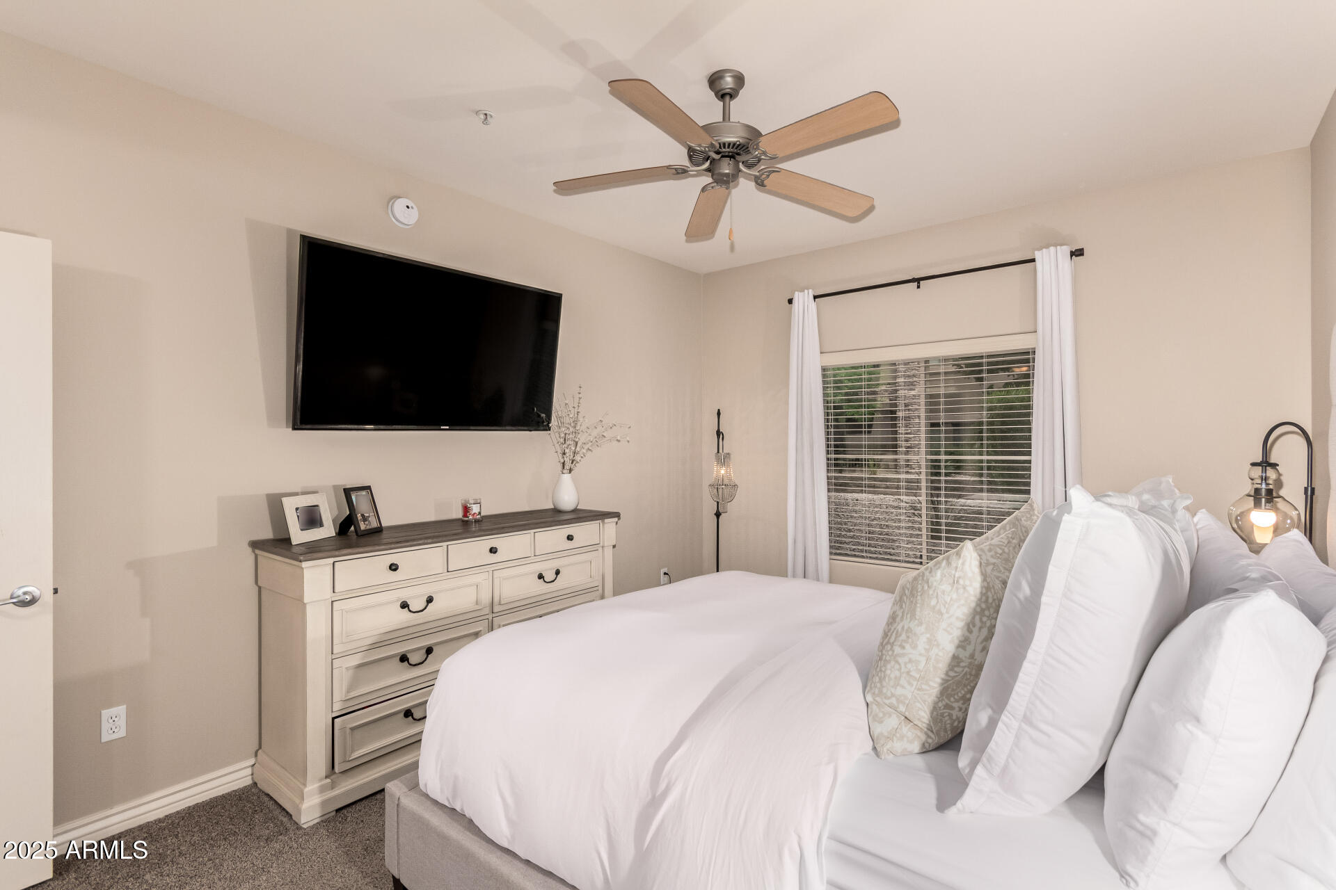 5350 East Deer Valley Drive, Unit 1259 Phoenix, AZ 85054 - Photo 10 of 35 a bedroom with a bed and a flat screen tv