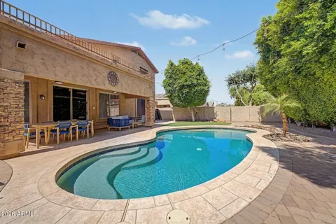 a view of a swimming pool with a patio