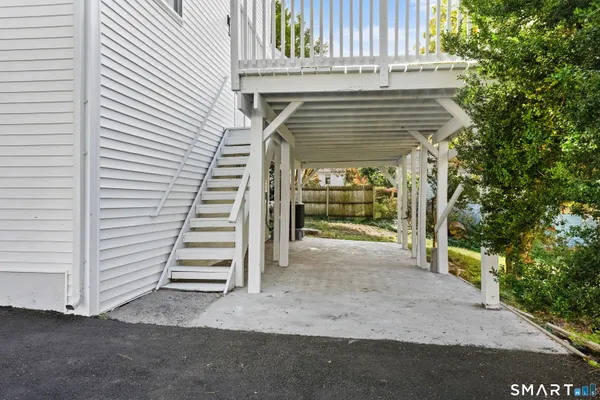 a view of a house with wooden fence