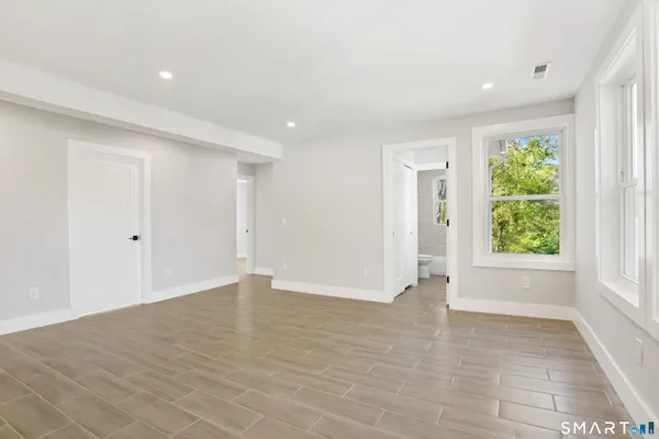 a view of an empty room with a window