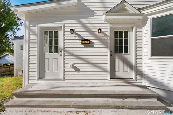 a view of a house with a door and a window