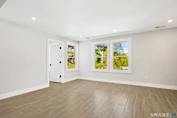 a view of an empty room with a window