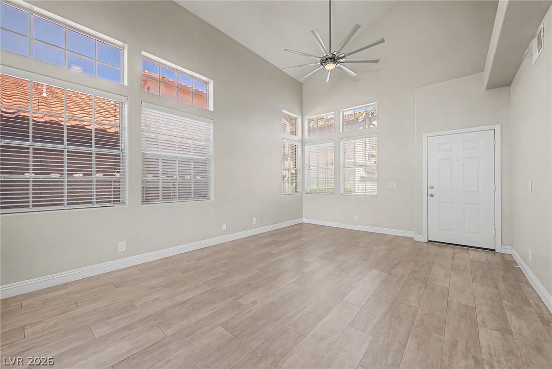 2316 Ramsgate Drive Henderson, NV 89074 - Photo 5 of 28 A spacious living area features high vaulted ceilings and abundant natural light.