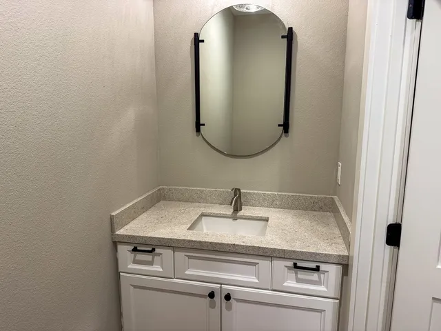 a sink with a mirror