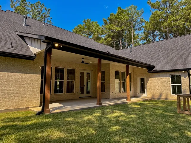 a view of a house with a backyard