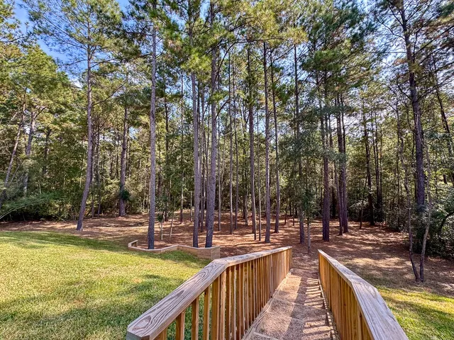 a view of a swimming pool with a patio and couches