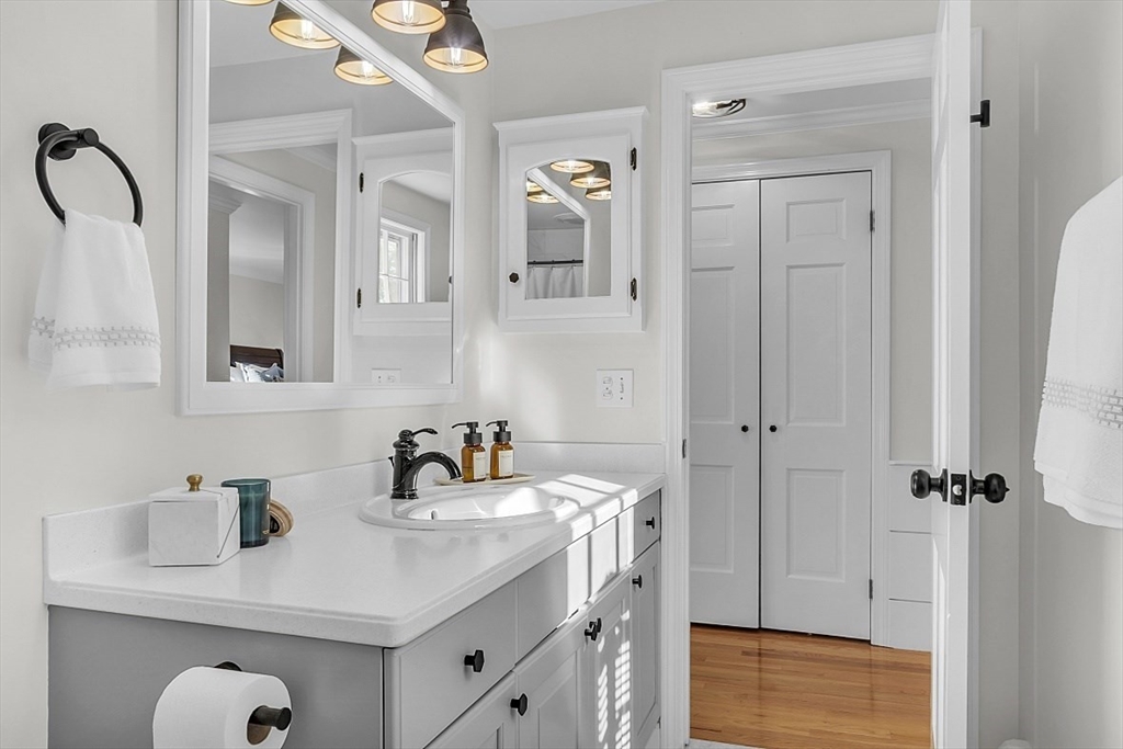 114 Bailey Road Andover, MA 01810 - Photo 21 of 42 a bathroom with a sink vanity and mirror